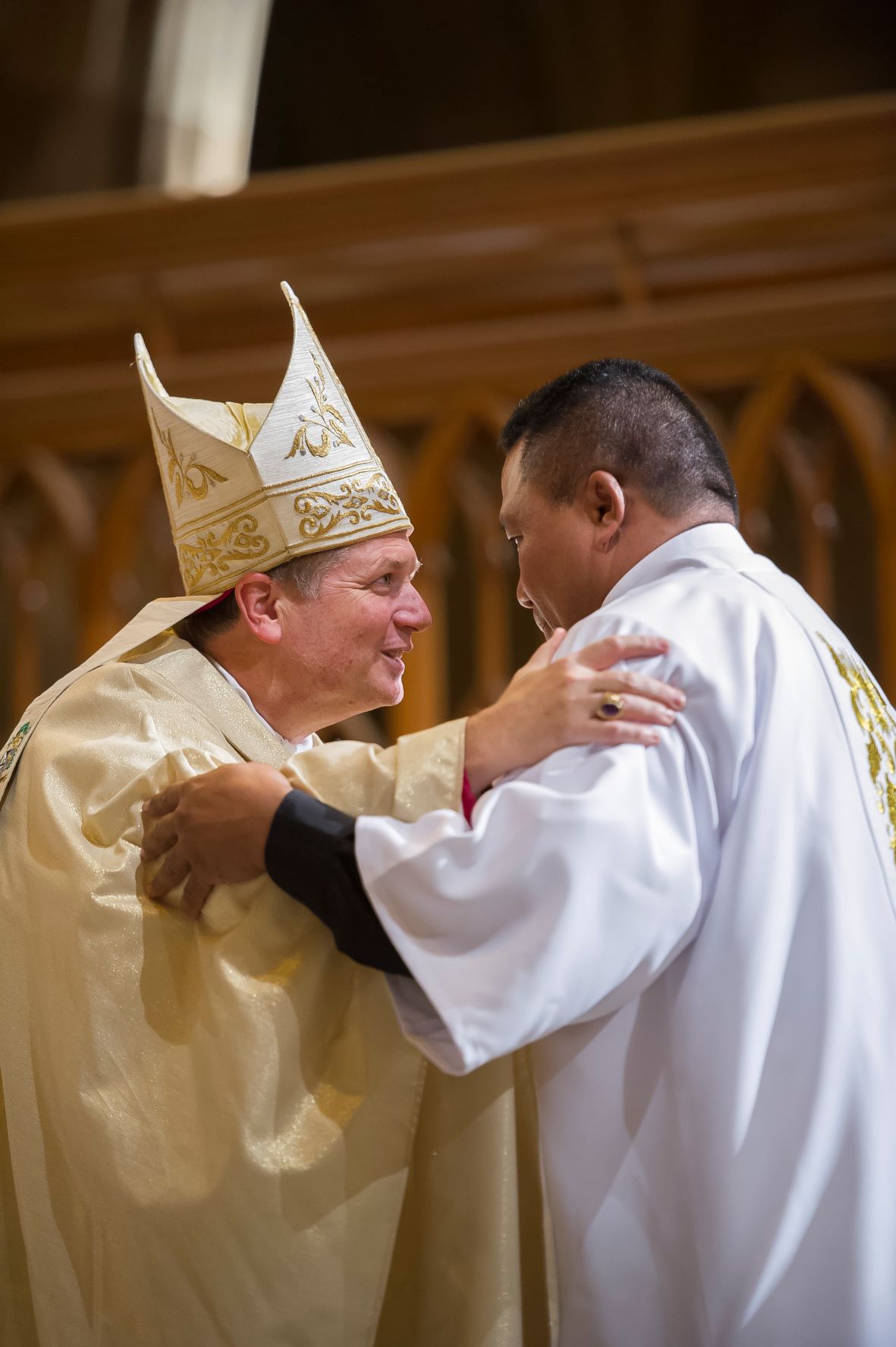 Deacon Aisavali Salu with Archbishop Fisher